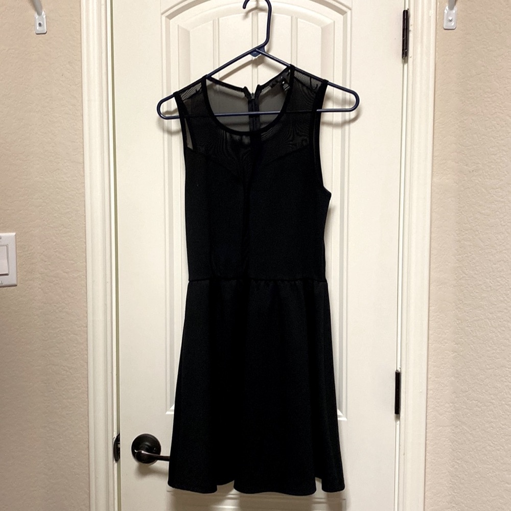 Black dress, knee length with see through back.
